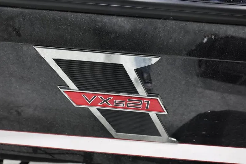 Slide: The Image of 2026 Vexus VXs21 logo on a sleek black surface. - 4