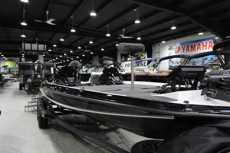 Slide: The Image of 2026 Vexus VXs21 boat displayed in a showroom with Yamaha signage. - 8