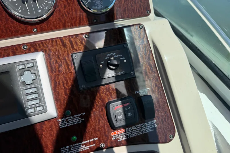 Slide: The Image of Control panel of a 2008 Sea Ray Sundancer 310 boat with heater and emergency start. - 15
