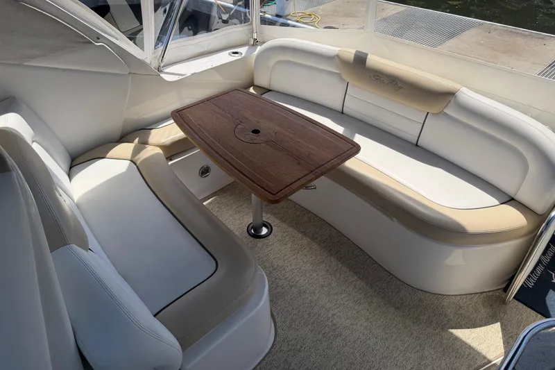 Slide: The Image of Luxurious seating area on 2008 Sea Ray Sundancer 310 yacht with wooden table. - 17