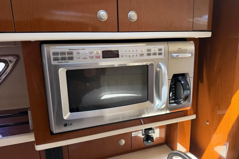 Slide: The Image of Built-in LG microwave and coffee maker in 2008 Sea Ray Sundancer 310 yacht kitchen. - 37