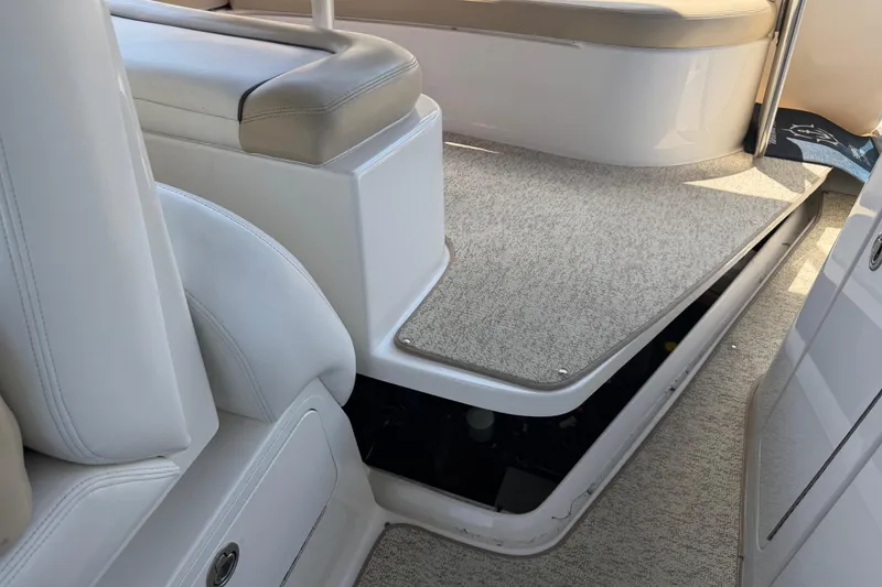 Slide: The Image of Interior view of 2008 Sea Ray Sundancer 310 boat with beige seating and carpeted flooring. - 42