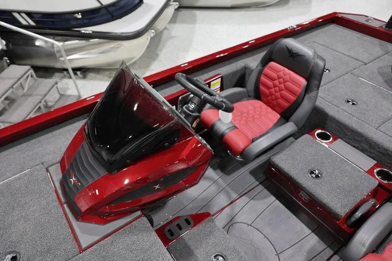 Slide: The Image of 2026 Vexus AVX 2100 boat interior with red and gray seating and sleek dashboard design. - 14