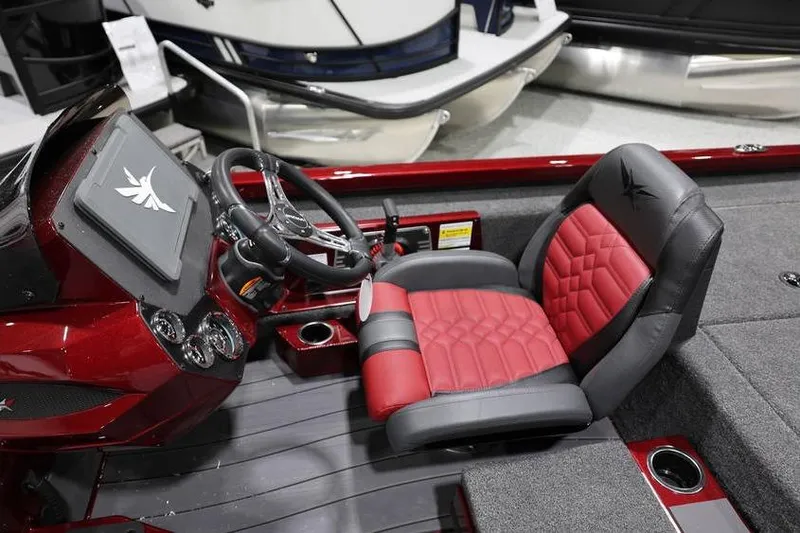 Slide: The Image of 2026 Vexus AVX 2100 boat interior with red and black seating and steering console. - 16