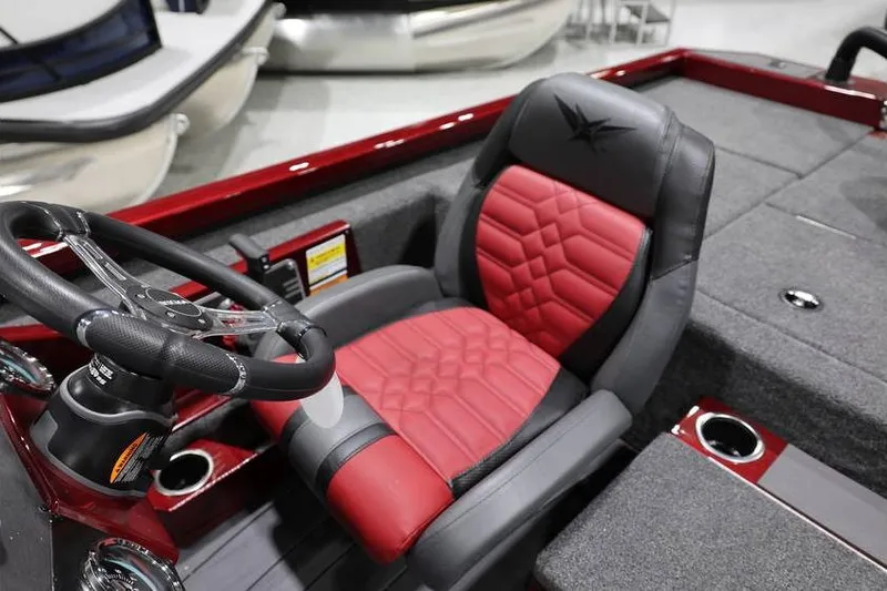 Slide: The Image of 2026 Vexus AVX 2100 boat interior with red and black seating and steering wheel. - 18