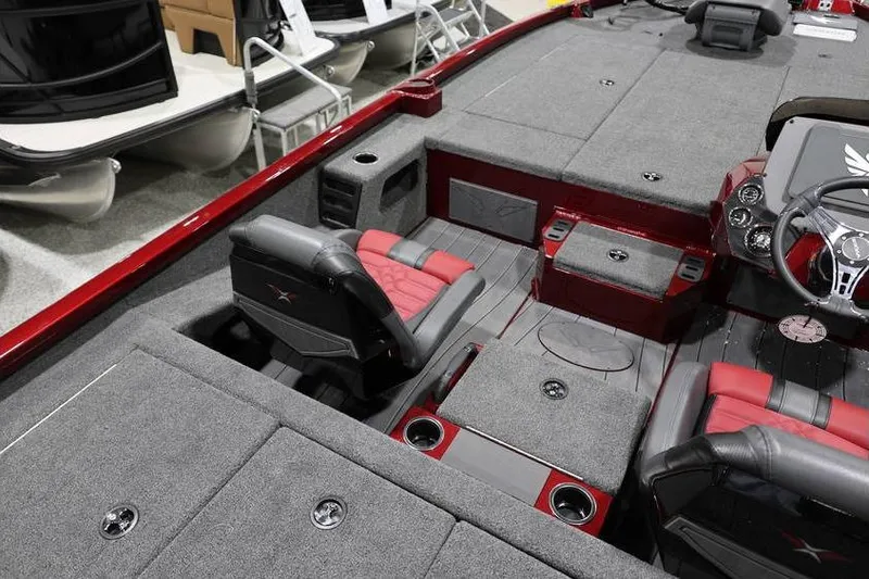 Slide: The Image of 2026 Vexus AVX 2100 boat interior with red and gray seating and carpeted deck. - 26
