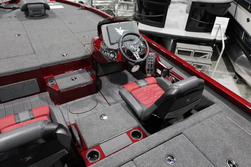 Slide: The Image of 2026 Vexus AVX 2100 boat interior with red and gray seating and modern dashboard. - 27