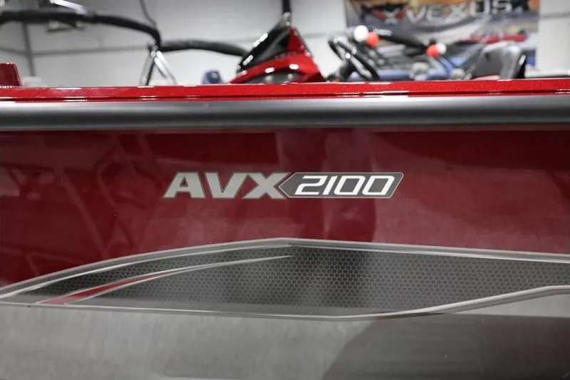 Slide: The Image of 2026 Vexus AVX 2100 boat, red exterior with sleek design details. - 32