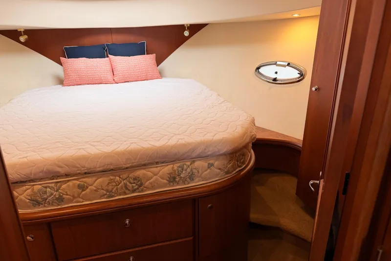 Slide: The Image of Luxurious bedroom interior of 2006 Silverton 38 Convertible yacht with cozy bedding. - 16