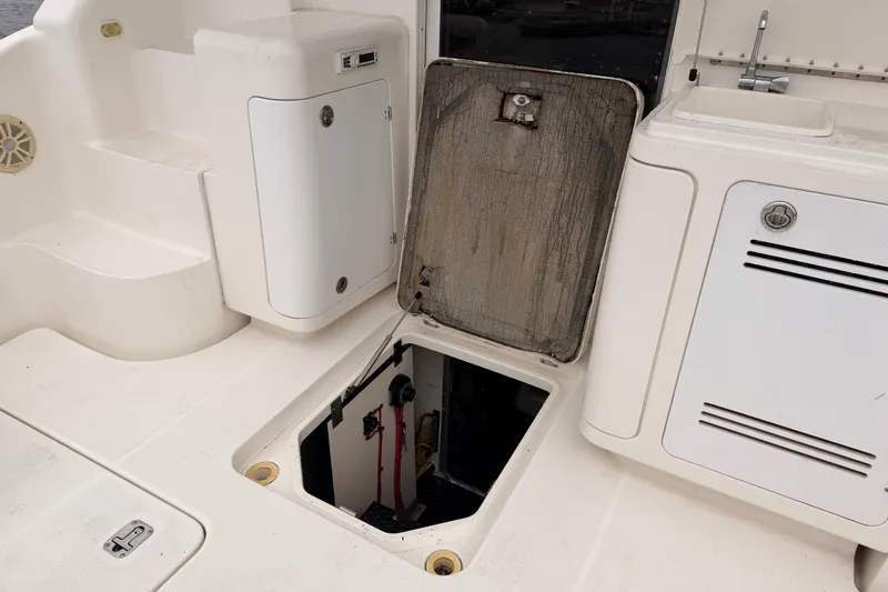 Slide: The Image of 2006 Silverton 38 Convertible boat interior with open hatch and storage compartments. - 7