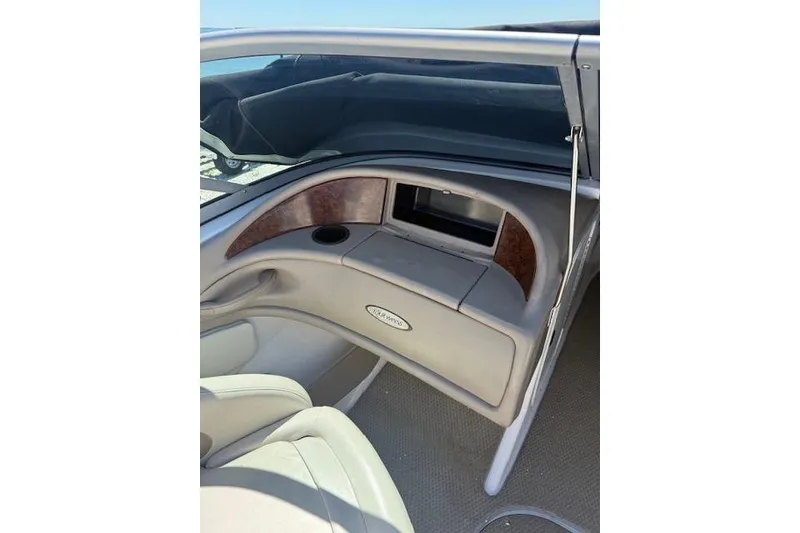 Slide: The Image of Interior view of a 2002 Four Winns 220 Horizon boat dashboard. - 12
