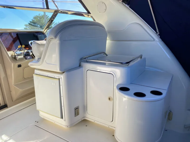 Slide: The Image of Interior of a 1999 Sea Ray 370 Express Cruiser with helm station. - 15