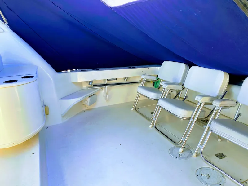 Slide: The Image of Interior of 1999 Sea Ray 370 Express Cruiser with white seating. - 21