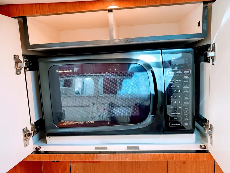 Slide: The Image of Panasonic microwave in 1999 Sea Ray 370 Express Cruiser. - 31