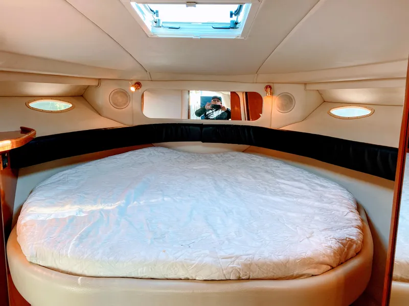 Slide: The Image of Interior of 1999 Sea Ray 370 Express Cruiser with cozy bed. - 34