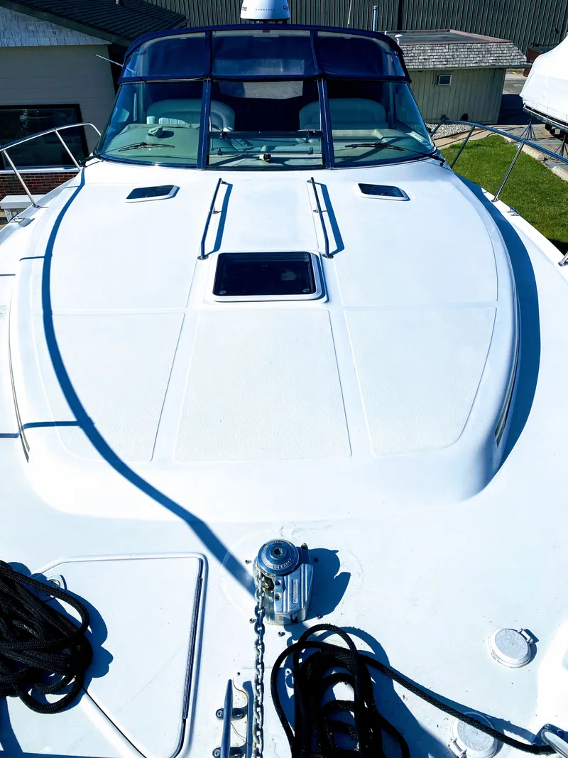 Slide: The Image of 1999 Sea Ray 370 Express Cruiser foredeck with anchor windlass. - 6