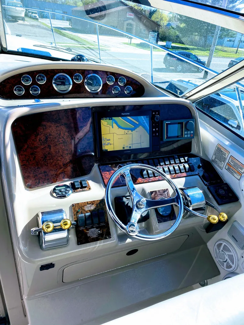 Slide: The Image of 1999 Sea Ray 370 Express Cruiser dashboard with navigation system. - 7