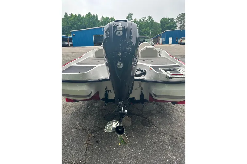 Slide: The Image of 2017 Nitro Z19 Sport boat with powerful outboard motor in a parking area. - 1
