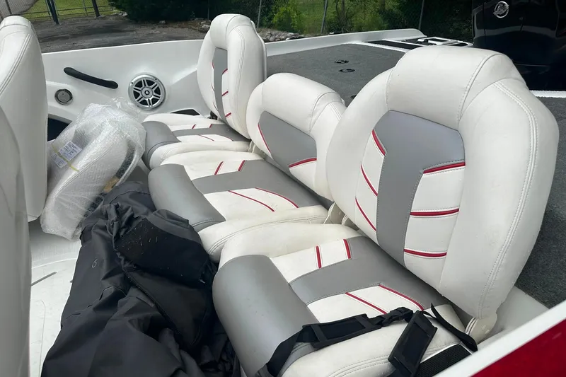 Slide: The Image of 2017 Nitro Z19 Sport boat interior with white and gray seats, red accents. - 6