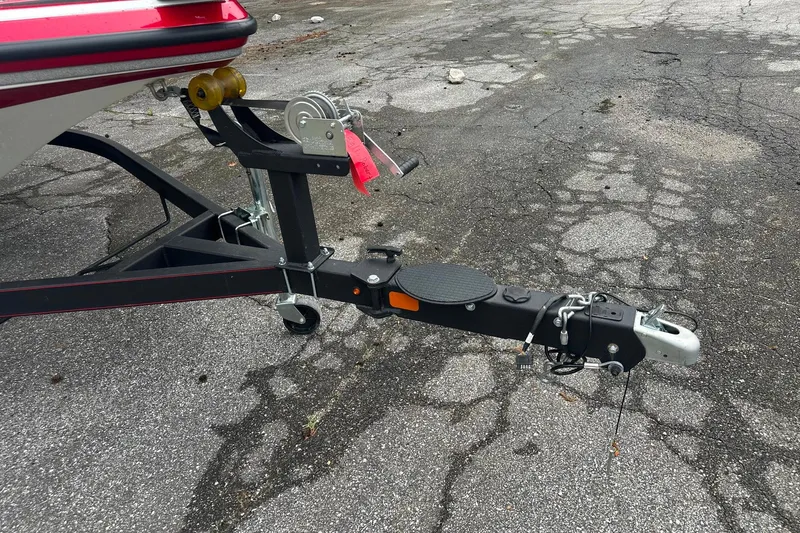 Slide: The Image of Trailer hitch of a 2017 Nitro Z19 Sport boat on cracked pavement. - 7