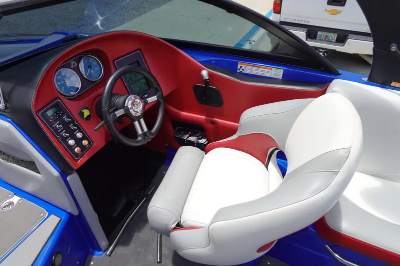 Slide: The Image of Interior of a 2013 Centurion Enzo SV244 boat with steering wheel and dashboard. - 14