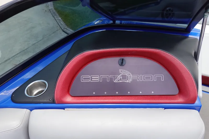 Slide: The Image of 2013 Centurion Enzo SV244 dashboard with red trim and cup holder. - 17