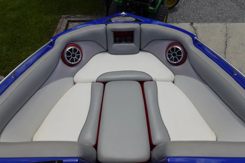 Slide: The Image of Interior of a 2013 Centurion Enzo SV244 boat with cushioned seating and speakers. - 19