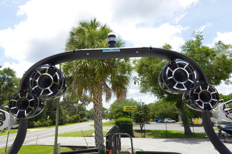 Slide: The Image of 2013 Centurion Enzo SV244 boat speakers with palm trees and road in background. - 22