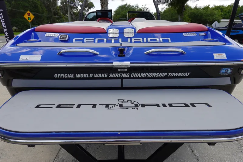 Slide: The Image of 2013 Centurion Enzo SV244 boat, blue and white, official wake surfing championship towboat. - 5