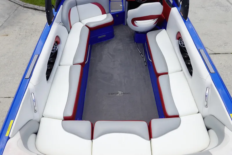 Slide: The Image of 2013 Centurion Enzo SV244 boat interior with white and red seating, blue accents. - 7
