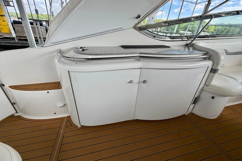 Slide: The Image of 2006 Formula 400 Super Sport yacht interior with sleek cabinetry and wood flooring. - 11