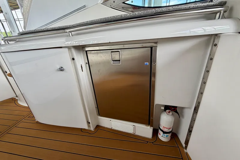 Slide: The Image of 2006 Formula 400 Super Sport yacht interior with stainless steel fridge and fire extinguisher. - 12