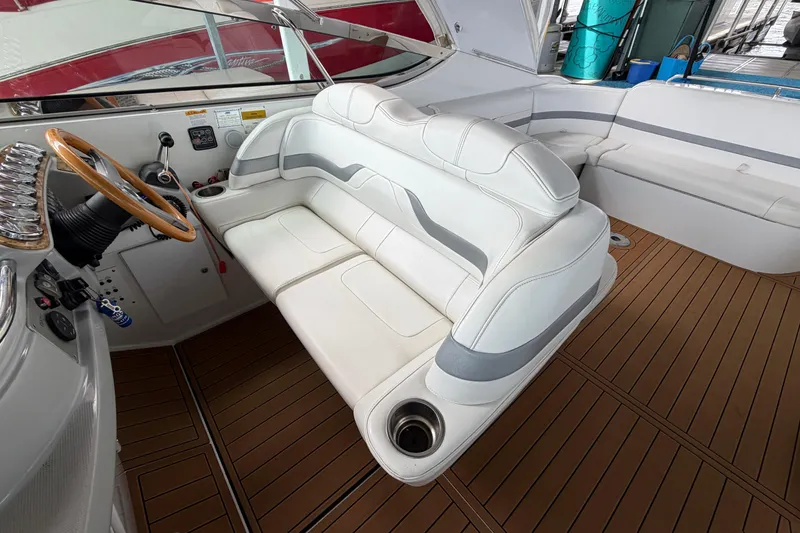 Slide: The Image of 2006 Formula 400 Super Sport boat interior with white seating and wooden steering wheel. - 15