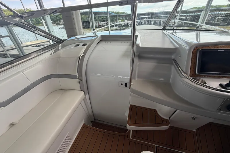 Slide: The Image of Interior of a 2006 Formula 400 Super Sport boat with seating and dashboard. - 21