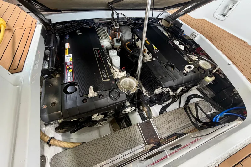 Slide: The Image of Engine compartment of a 2006 Formula 400 Super Sport boat, showcasing dual engines. - 25