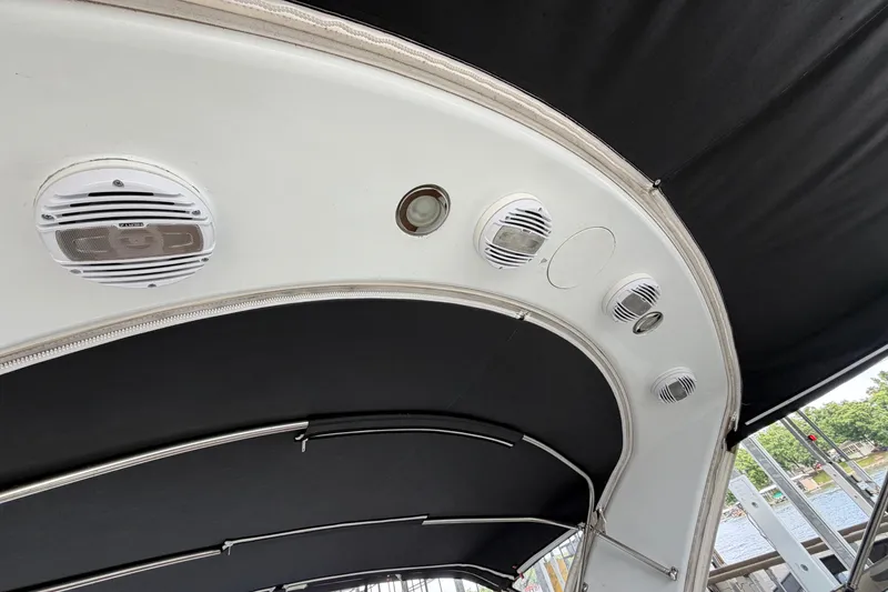 Slide: The Image of Interior view of a 2006 Formula 400 Super Sport boat with speakers and canopy. - 29