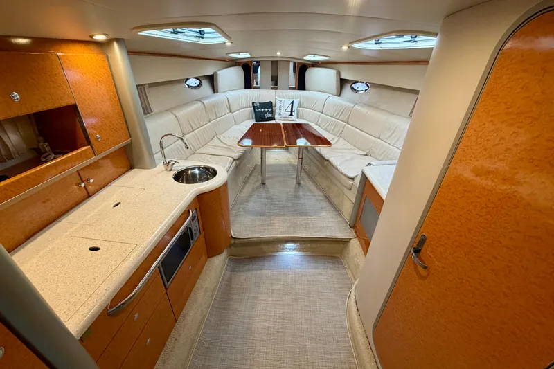 Slide: The Image of Interior of a 2006 Formula 400 Super Sport yacht with modern kitchen and seating area. - 30