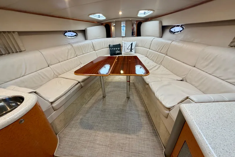 Slide: The Image of Luxurious interior of a 2006 Formula 400 Super Sport yacht with plush seating and elegant table. - 31