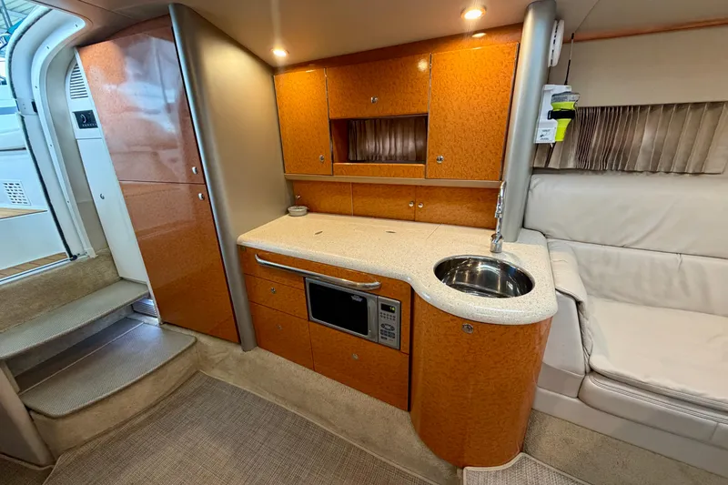 Slide: The Image of Luxurious 2006 Formula 400 Super Sport yacht interior with kitchenette and seating area. - 32