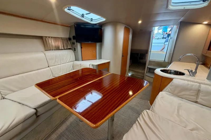Slide: The Image of Interior of a 2006 Formula 400 Super Sport yacht with elegant seating and wooden table. - 33