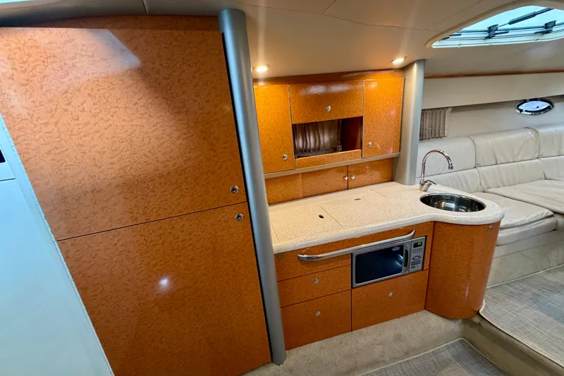 Slide: The Image of Interior of 2006 Formula 400 Super Sport yacht with kitchenette and seating area. - 36