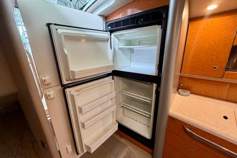 Slide: The Image of Open refrigerator in 2006 Formula 400 Super Sport boat interior. - 37