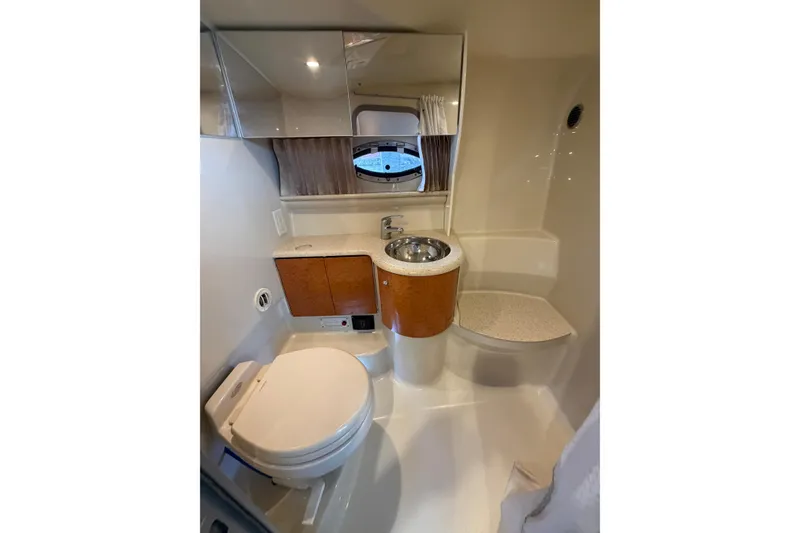 Slide: The Image of Bathroom interior of 2006 Formula 400 Super Sport boat, featuring sink and toilet. - 40
