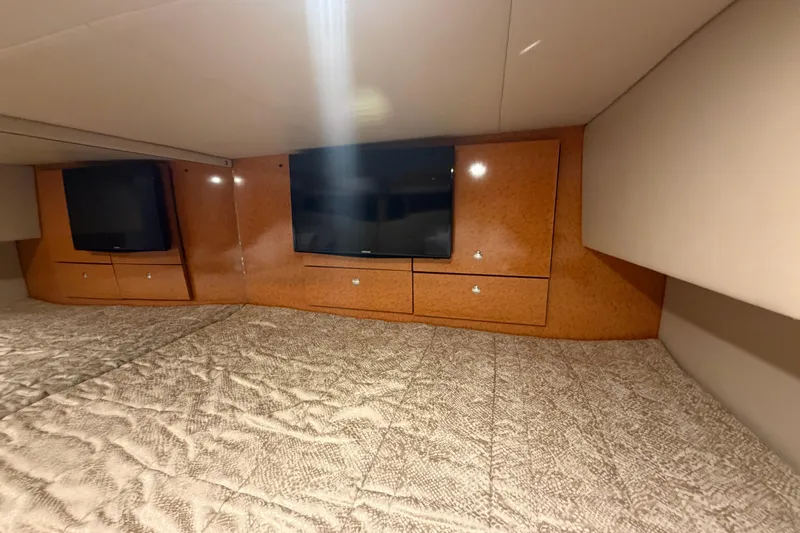 Slide: The Image of Interior cabin of 2006 Formula 400 Super Sport with wood paneling and TV. - 42