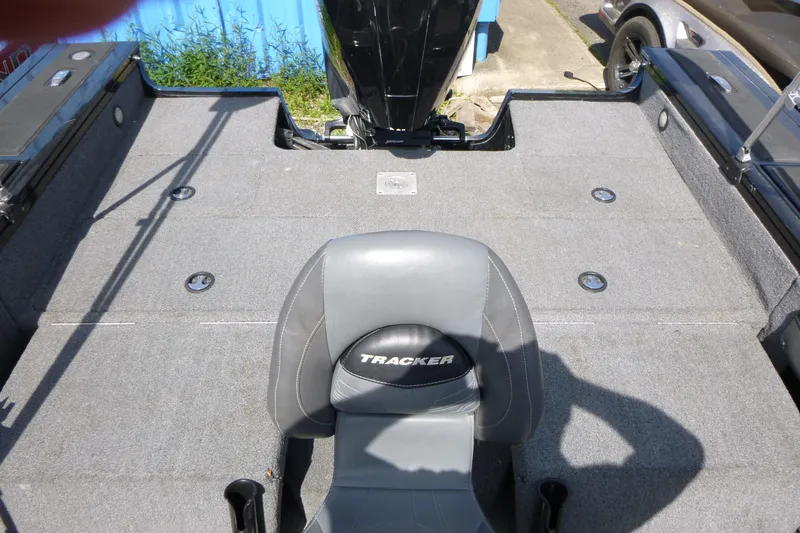 Slide: The Image of 2020 Tracker Targa V-19 Combo Tournament Edition boat interior with gray seating and carpeted deck. - 14