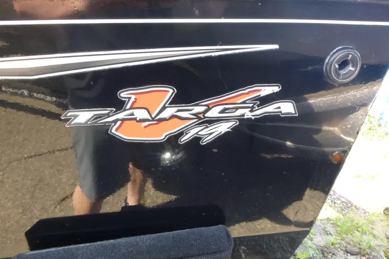Slide: The Image of 2020 Tracker Targa V-19 Combo Tournament Edition logo on black surface. - 16