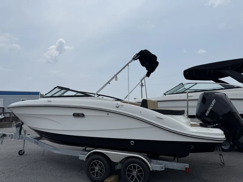 Slide: The Image of A 2026 Sea Ray SPX 210 Outboard on a trailer. It features a sleek, modern design. - 4