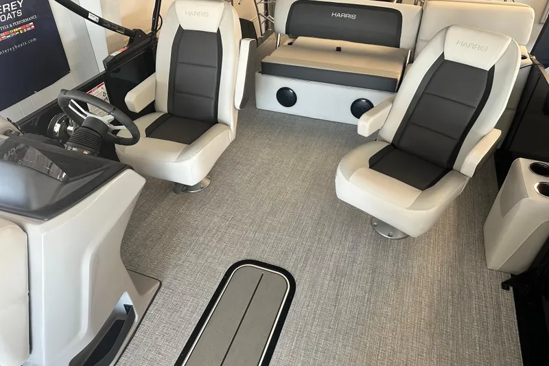 Slide: The Image of 2026 Harris Cruiser 230 SLDH interior with plush seating and modern helm design. - 3