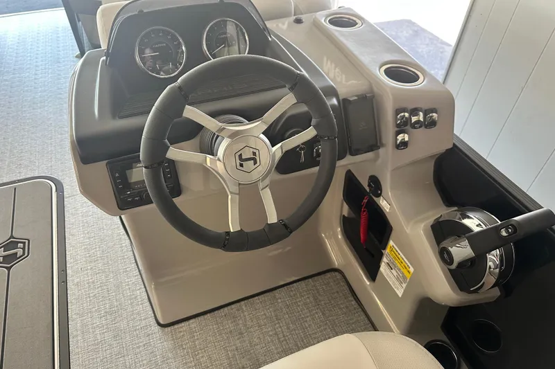 Slide: The Image of 2026 Harris Cruiser 230 SLDH boat dashboard with steering wheel and control panel. - 7