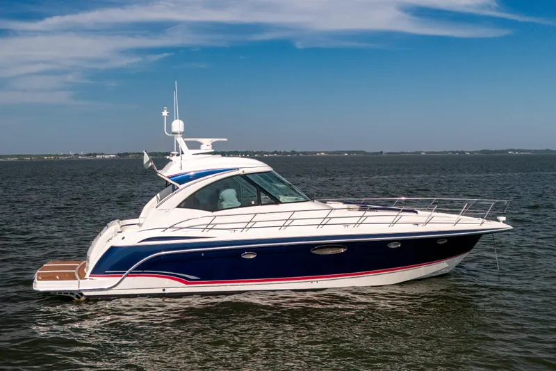 Slide: The Image of 2010 Formula 45 Yacht cruising on open water under a clear blue sky. - 1